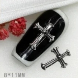 Amuletos de uñas en forma de cruz