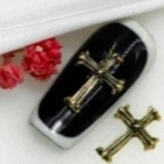 Amuletos de uñas en forma de cruz