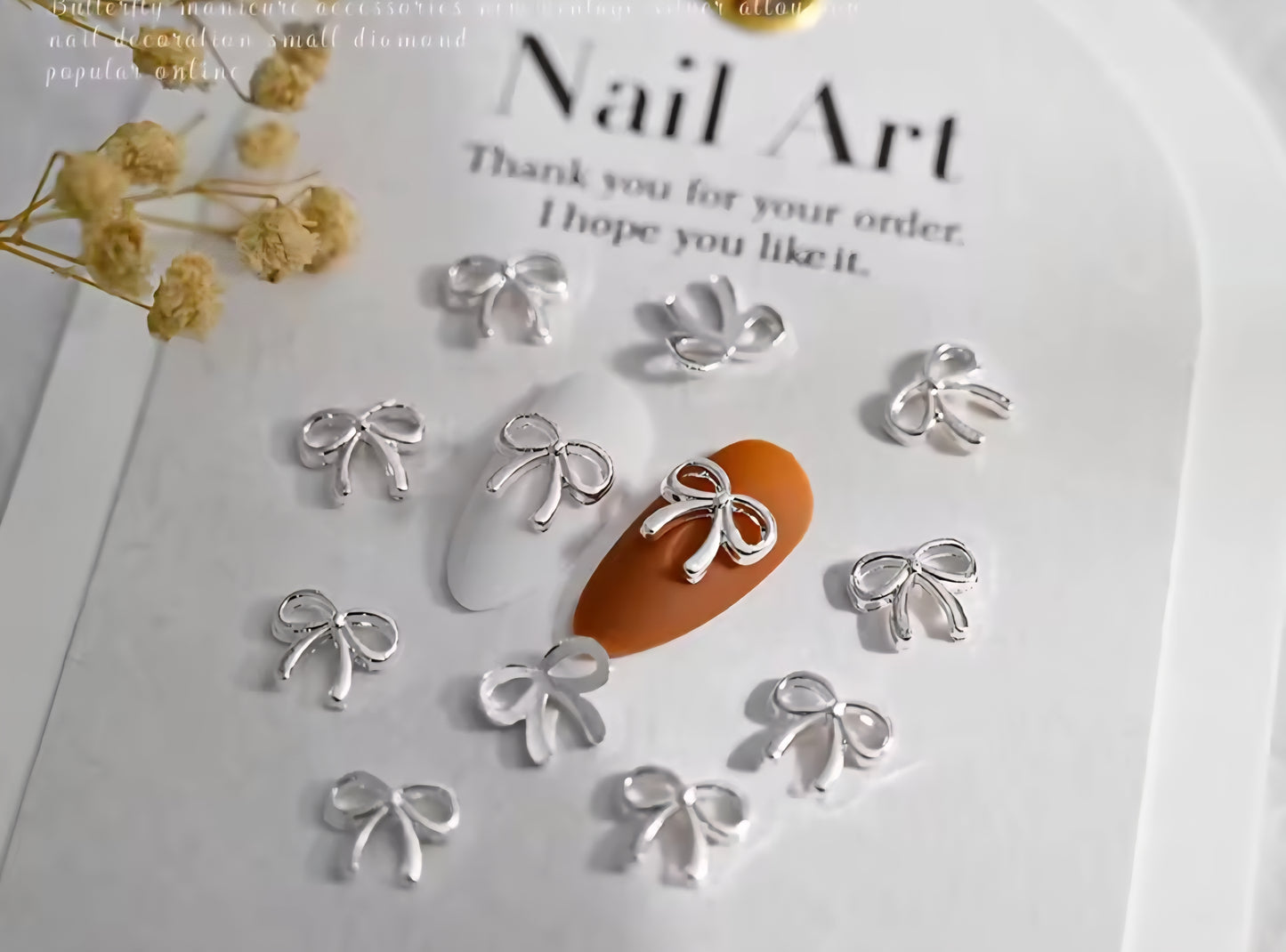 Adornos para uñas con forma de lazo